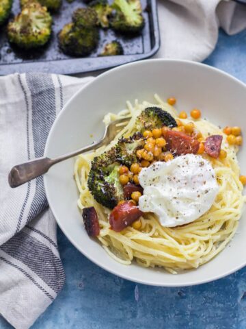 Chickpea Recipes: This garlic pasta is a simple weeknight meal packed with garlicky flavour and topped with delicious roasted broccoli, crispy chickpeas and chorizo. Finished with a poached egg.