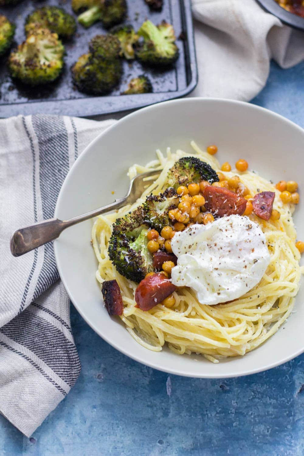This garlic pasta is a simple weeknight meal packed with garlicky flavour and topped with delicious roasted broccoli, crispy chickpeas and chorizo. Finished with a poached egg.