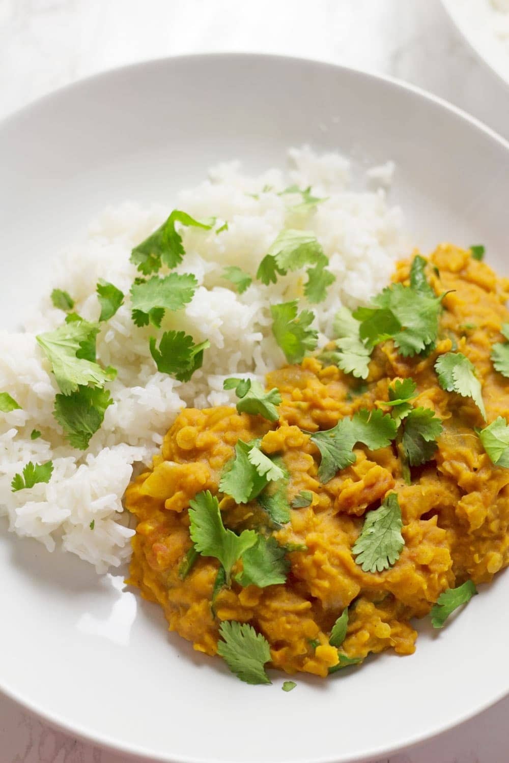 This red lentil dal is perfect when you're craving that curry flavour but you want something quick and healthy. Serve with yoghurt and mango chutney. 