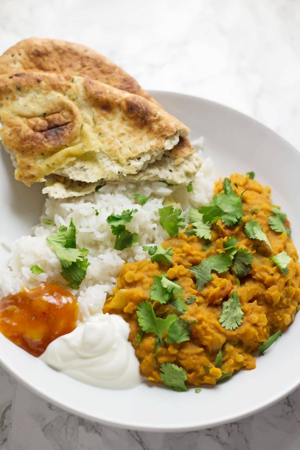 This red lentil dal is perfect when you're craving that curry flavour but you want something quick and healthy. Serve with yoghurt and mango chutney. 