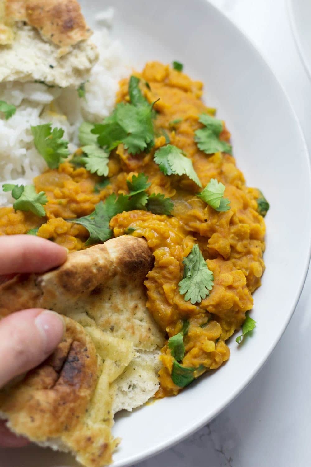 This red lentil dal is perfect when you're craving that curry flavour but you want something quick and healthy. Serve with yoghurt and mango chutney. 