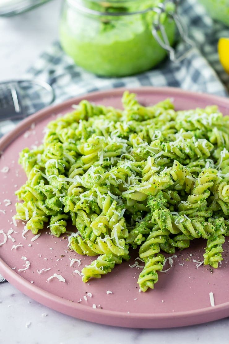 Pink plate of pasta with spinach pesto 