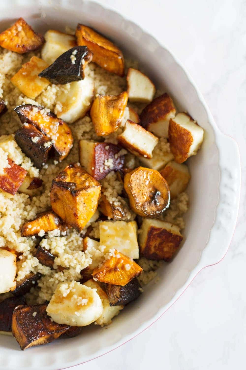 This vibrant halloumi, sweet potato and bulgur wheat salad is full of saltiness from the halloumi and olives and creamy sweetness from the sweet potato.