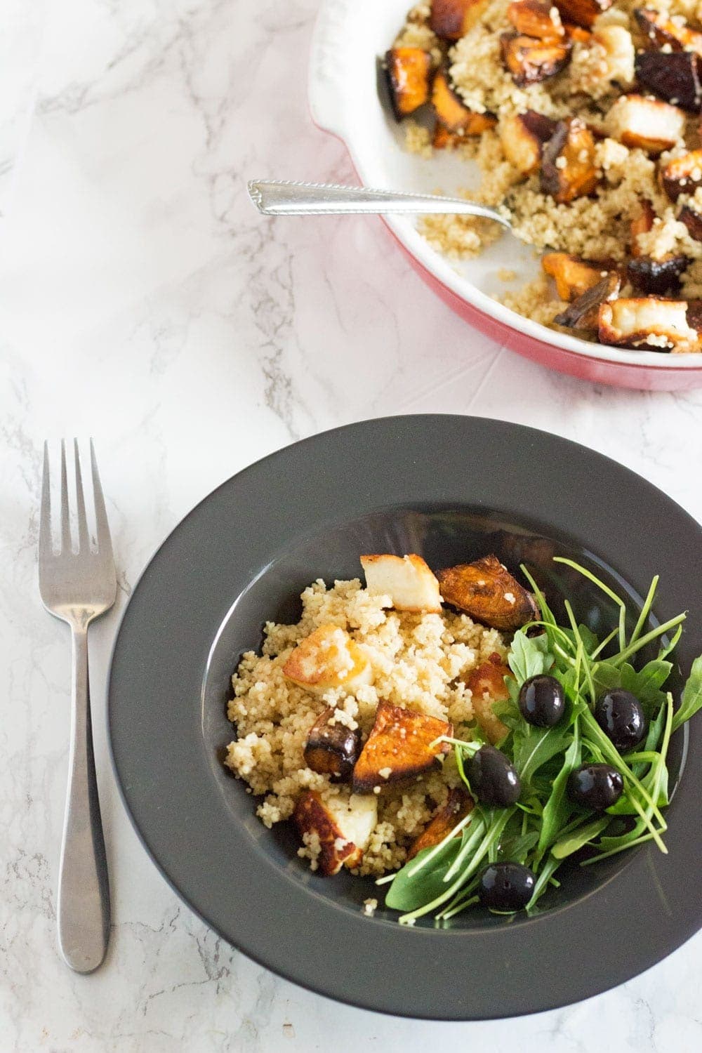 This vibrant halloumi, sweet potato and bulgur wheat salad is full of saltiness from the halloumi and olives and creamy sweetness from the sweet potato.