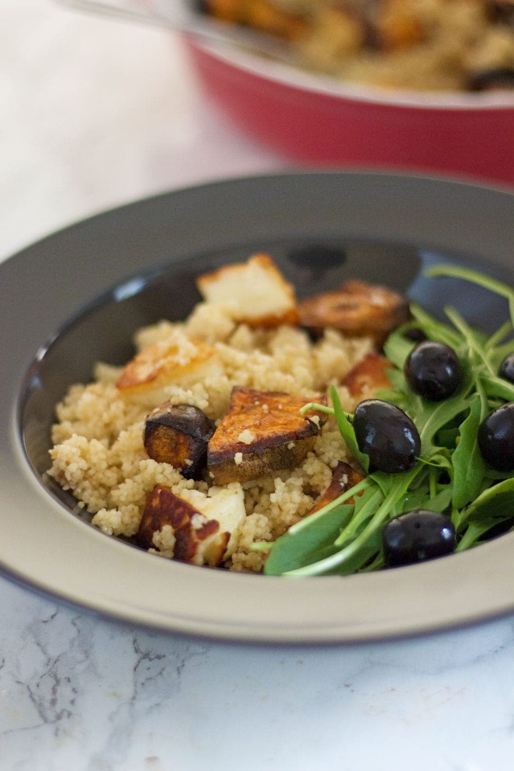 This vibrant halloumi, sweet potato and bulgur wheat salad is full of saltiness from the halloumi and olives and creamy sweetness from the sweet potato.