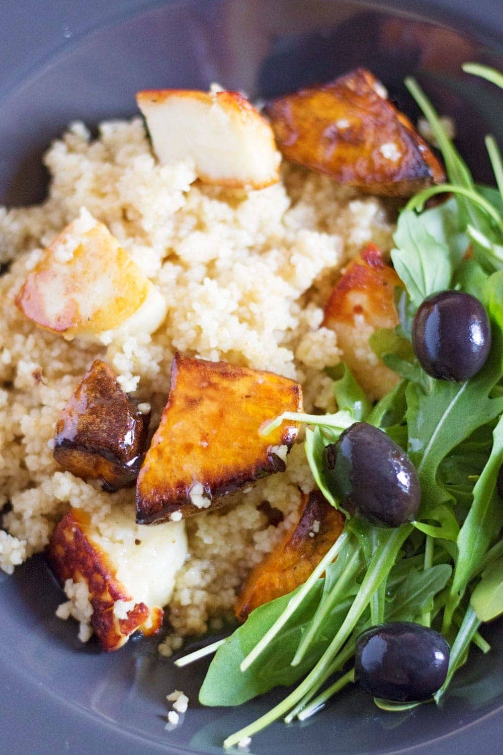 This vibrant halloumi, sweet potato and bulgur wheat salad is full of saltiness from the halloumi and olives and creamy sweetness from the sweet potato.