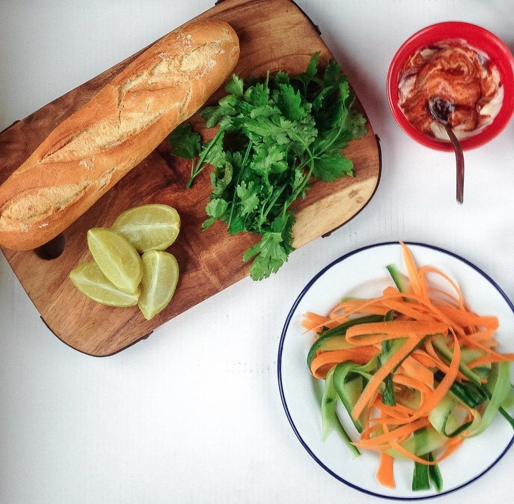 This Korean pork banh mi has meatballs cooked until crisp on the outside then topped with gochujang mayo, carrot, cucumber and quick pickled onions.