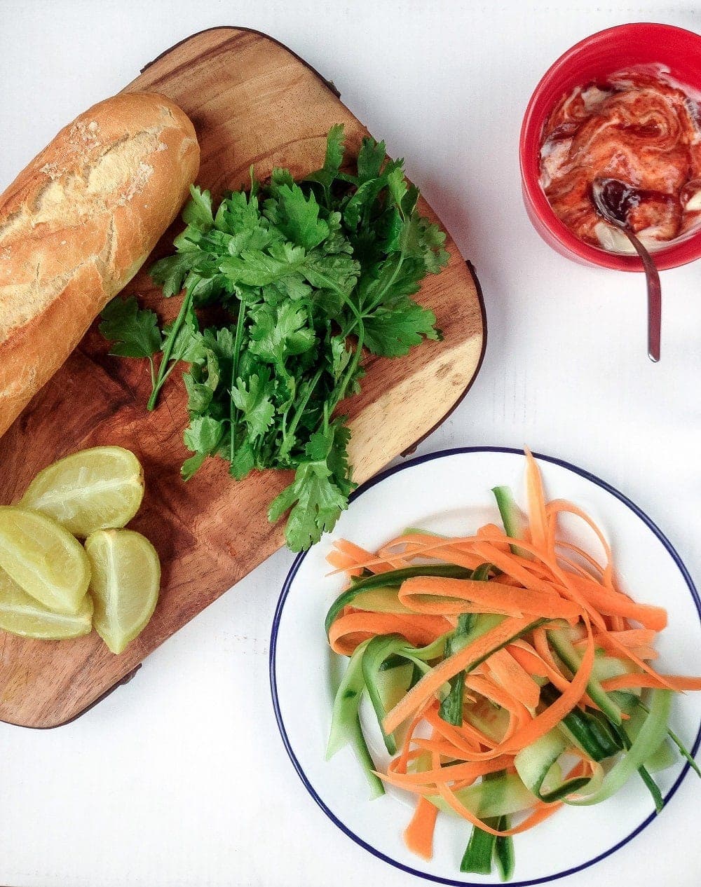 This Korean pork banh mi has meatballs cooked until crisp on the outside then topped with gochujang mayo, carrot, cucumber and quick pickled onions.