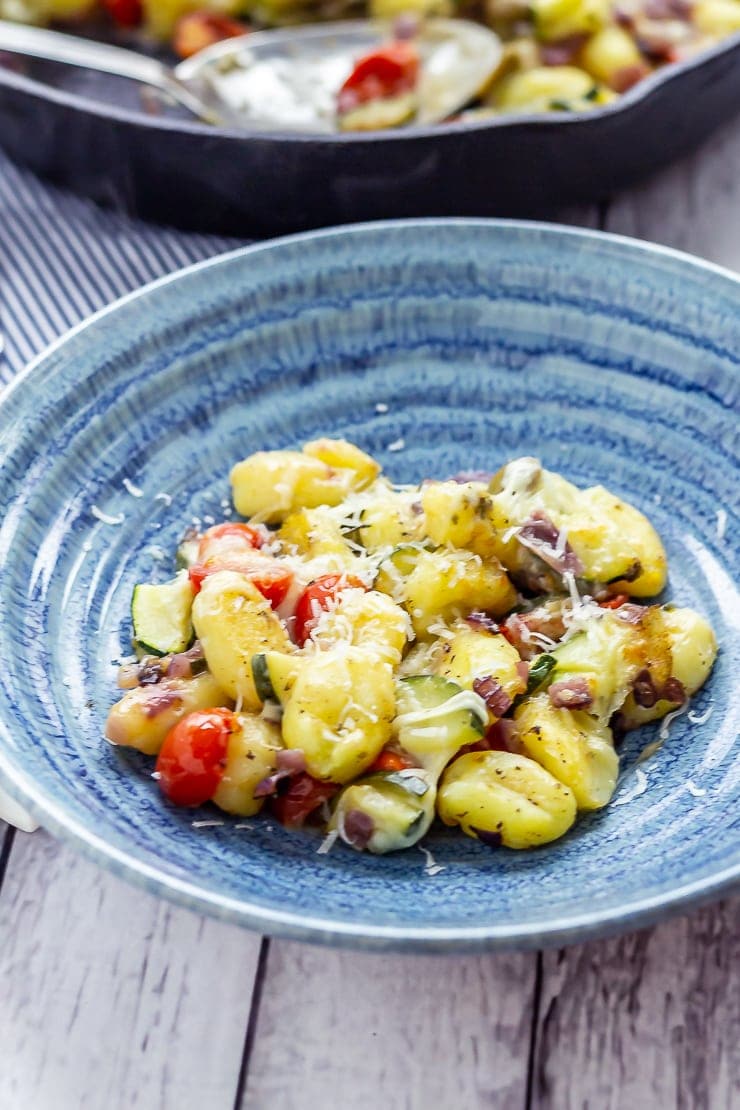 Summer gnocchi skillet in a blue bowl