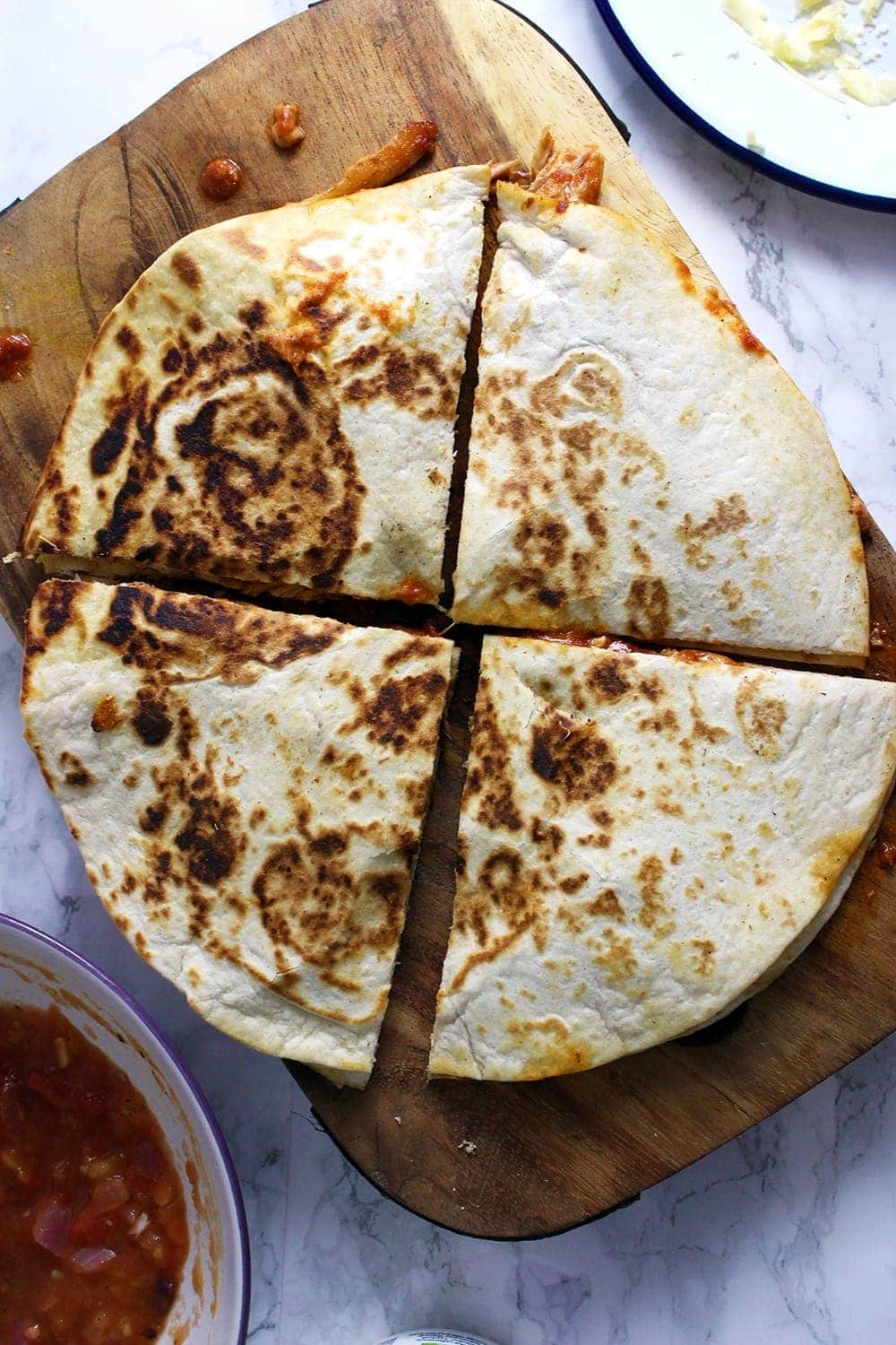 These slow cooker chipotle chicken quesadillas are the perfect weeknight dinner. At the end of the day just shred your chicken and fry up some quesadillas!