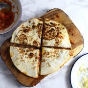 These slow cooker chipotle chicken quesadillas are the perfect weeknight dinner. At the end of the day just shred your chicken and fry up some quesadillas!