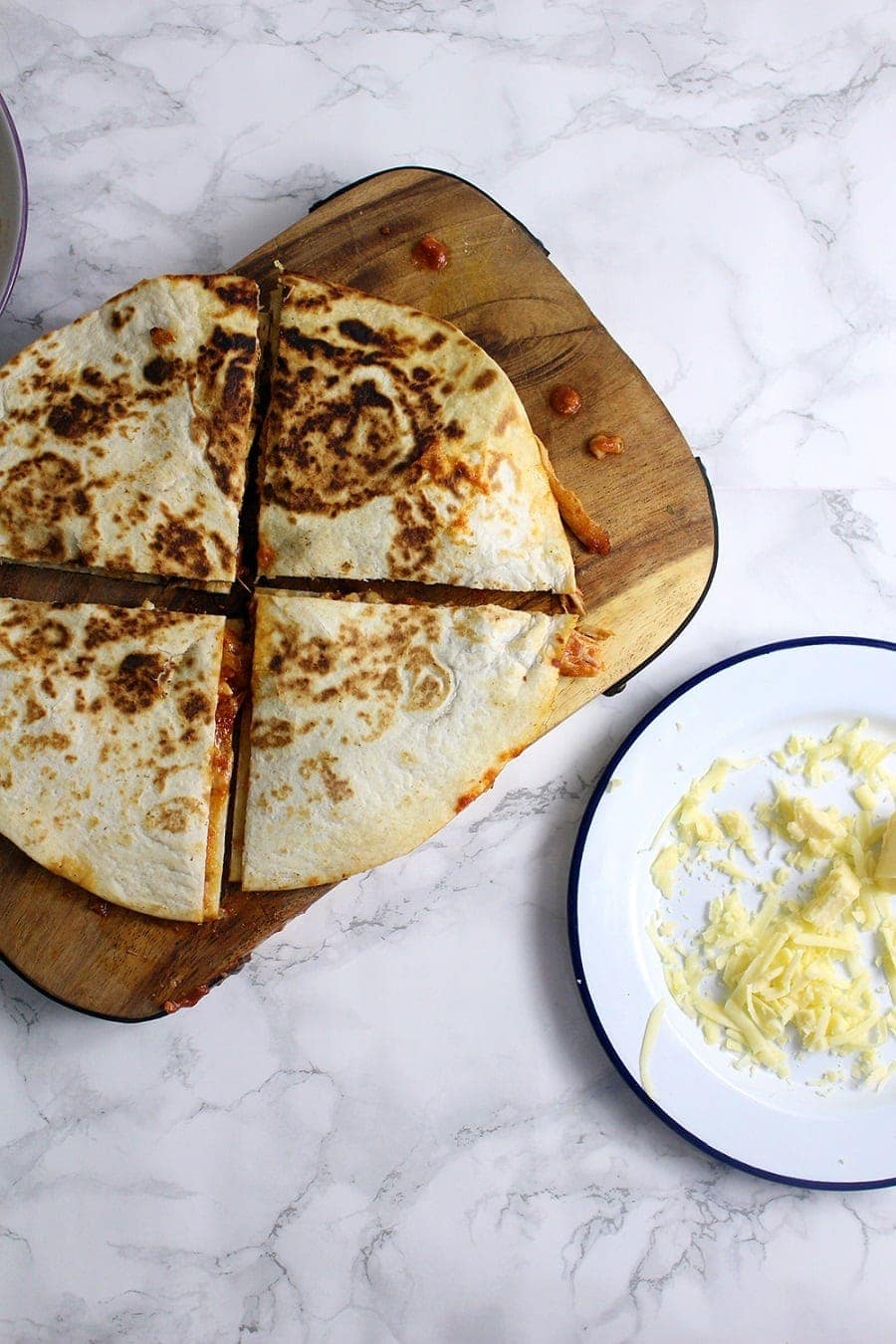 These slow cooker chipotle chicken quesadillas are the perfect weeknight dinner. At the end of the day just shred your chicken and fry up some quesadillas!