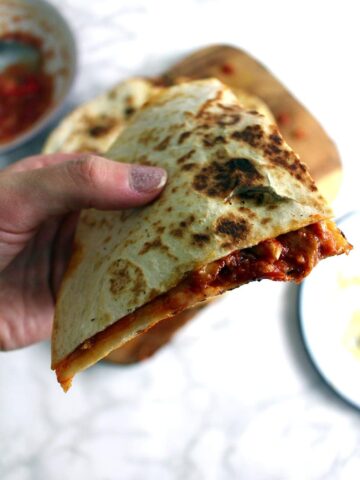 These slow cooker chipotle chicken quesadillas are the perfect weeknight dinner. At the end of the day just shred your chicken and fry up some quesadillas!
