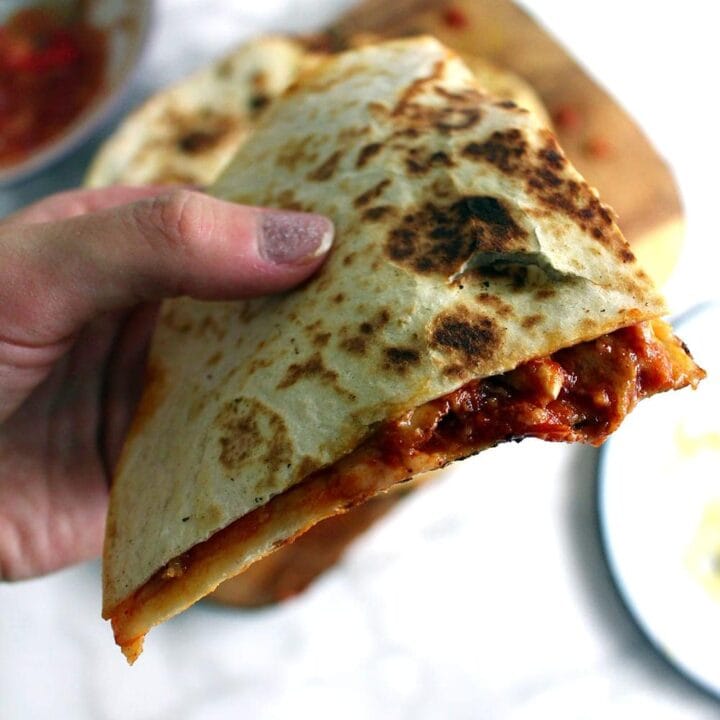 These slow cooker chipotle chicken quesadillas are the perfect weeknight dinner. At the end of the day just shred your chicken and fry up some quesadillas!