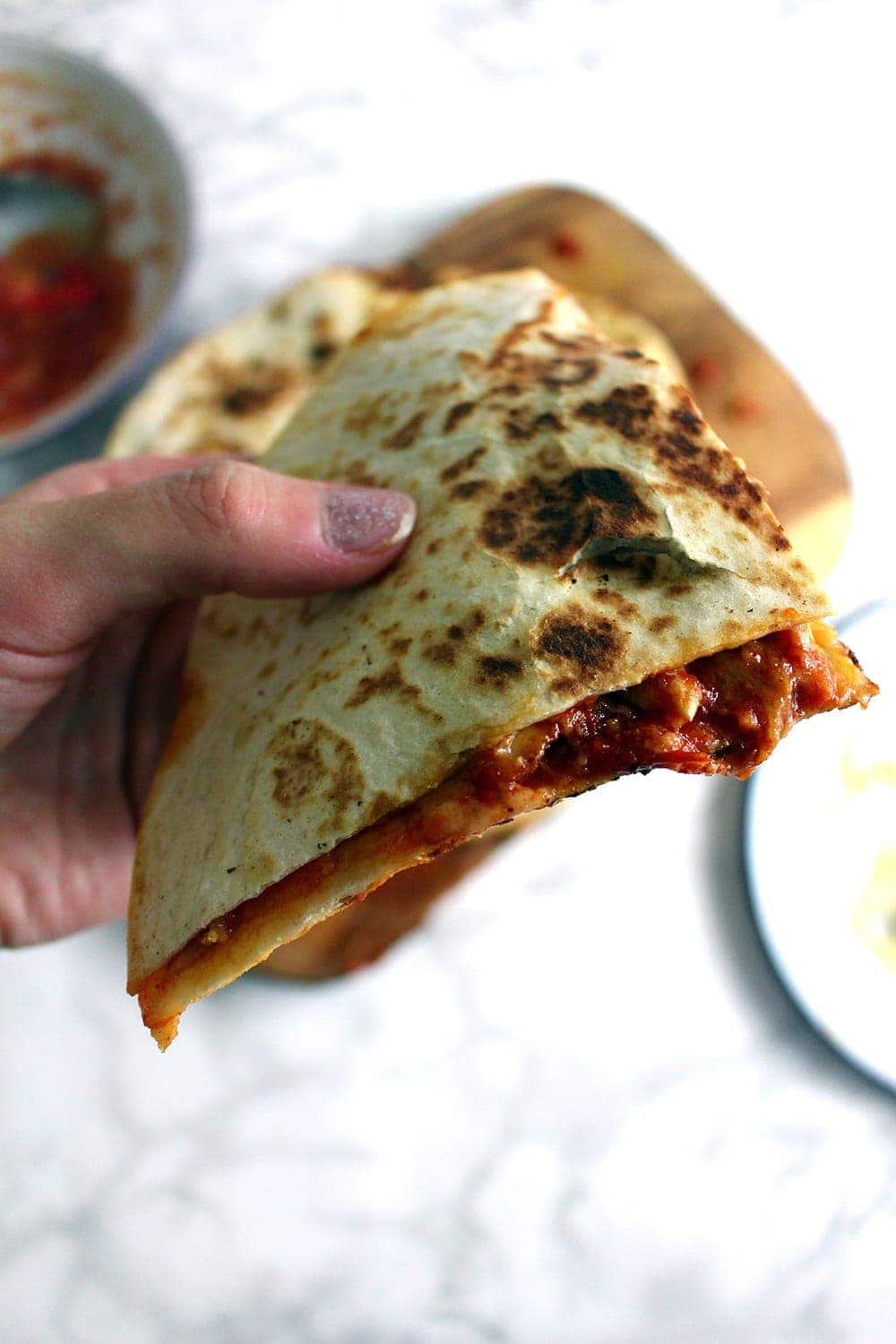 These slow cooker chipotle chicken quesadillas are the perfect weeknight dinner. At the end of the day just shred your chicken and fry up some quesadillas!