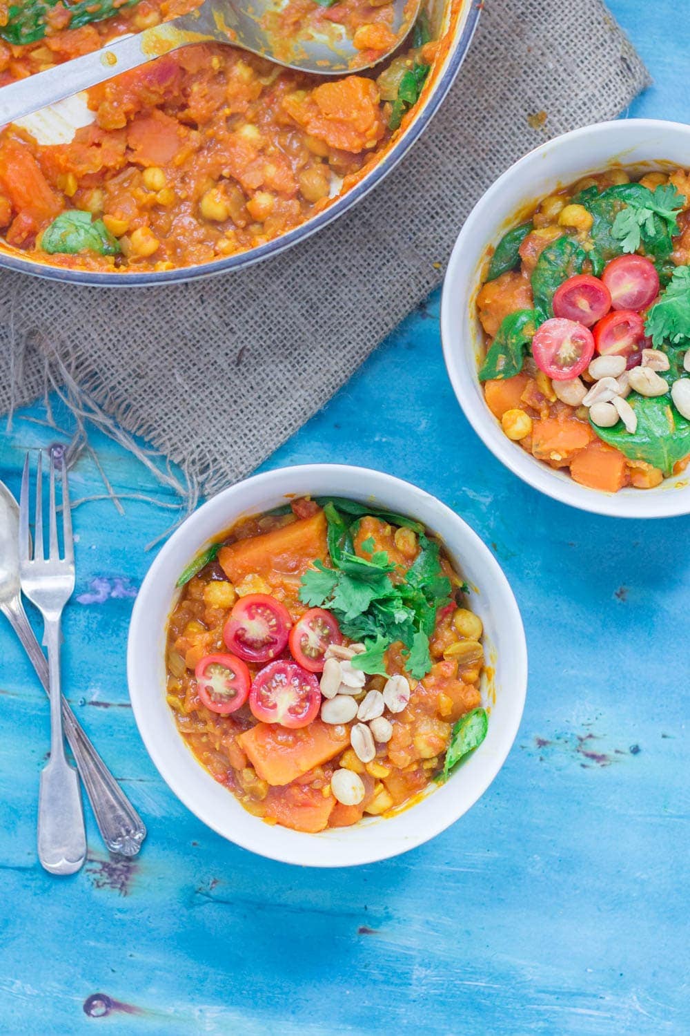 This peanut and sweet potato stew is spicy, filling and delicious. Add all your favourite toppings and serve with a healthy portion of rice or other grain. #vegetarian #comfortfood #healthy