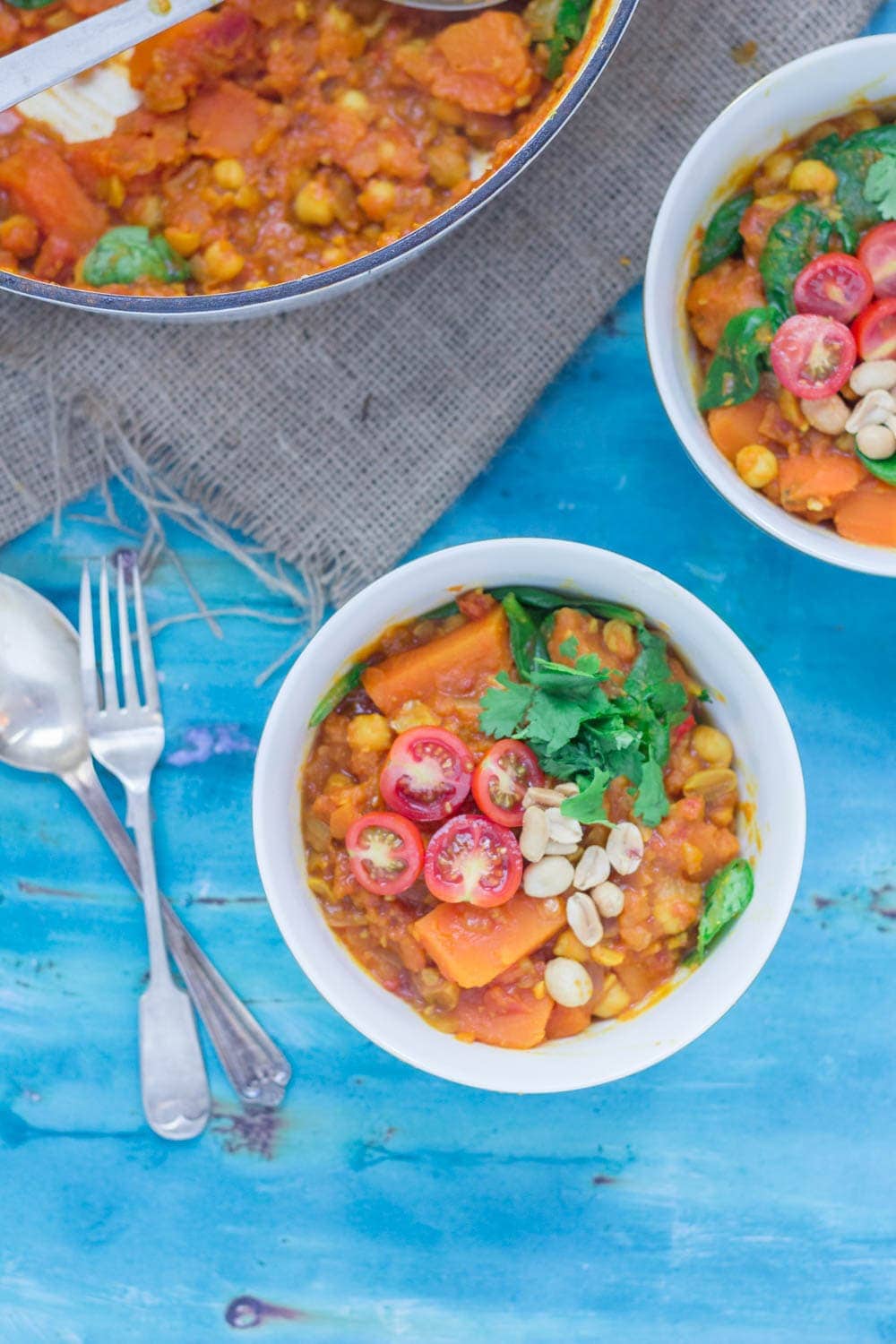 This peanut and sweet potato stew is spicy, filling and delicious. Add all your favourite toppings and serve with a healthy portion of rice or other grain. #vegetarian #comfortfood #healthy