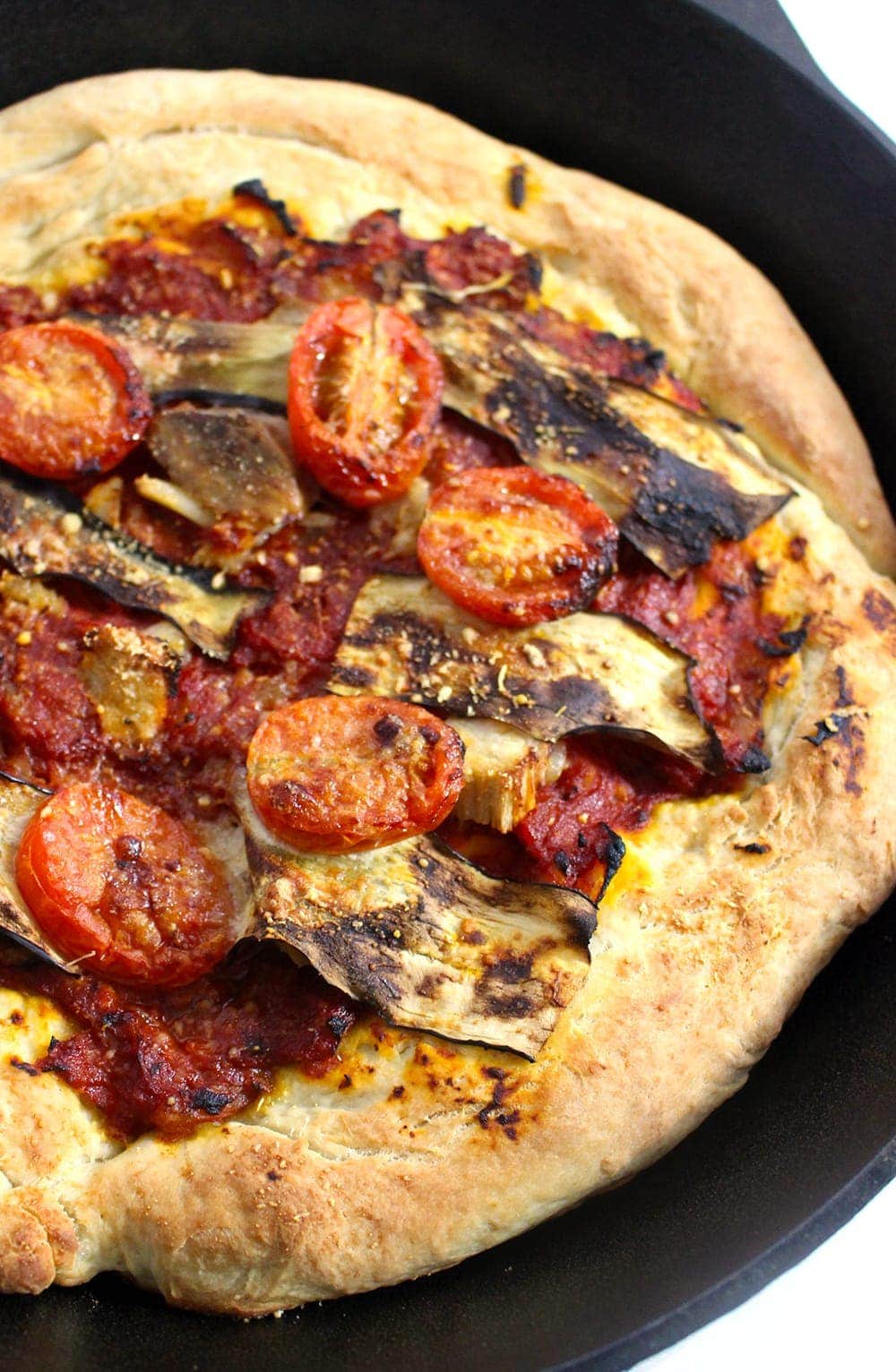 This roasted garlic, pork & aubergine pizza is the perfect combination of garlicky, meaty, salty goodness. It's perfect for using up leftover roast pork!