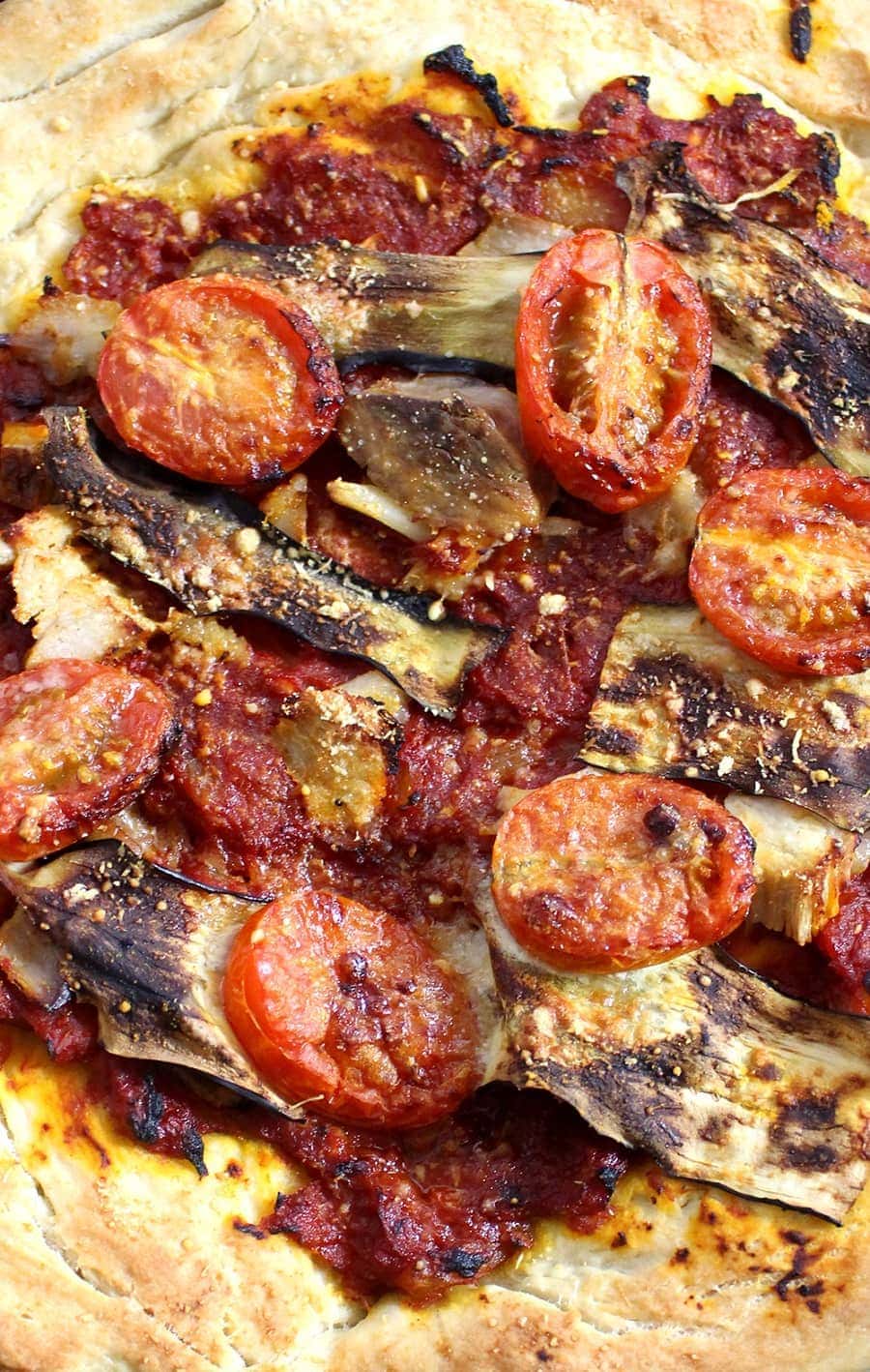 This roasted garlic, pork & aubergine pizza is the perfect combination of garlicky, meaty, salty goodness. It's perfect for using up leftover roast pork!