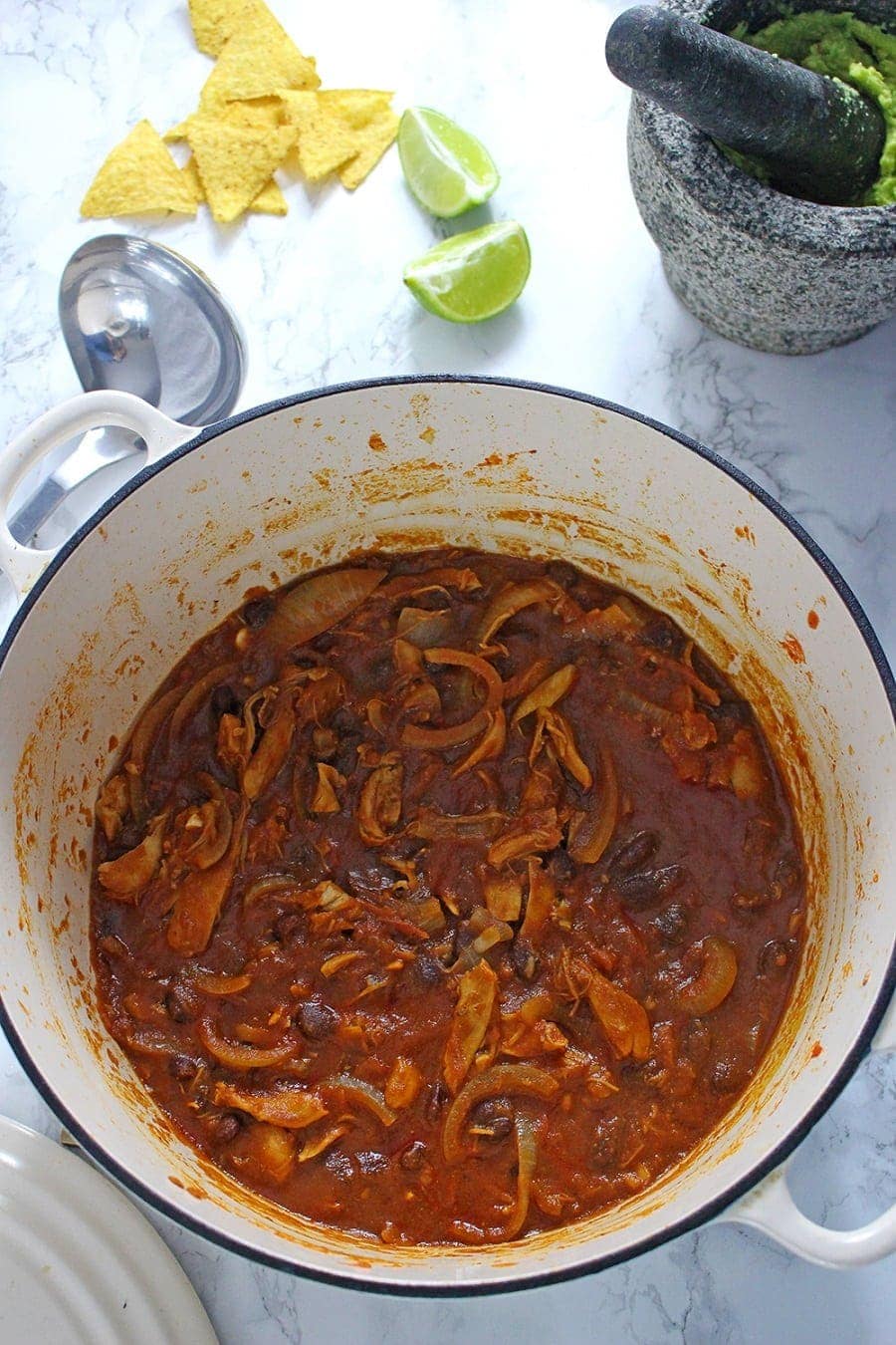 These chicken chili nachos are a perfect party dish! Surprisingly quick to put together, you can make them even easier by using pre-cooked chicken. 