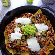 These chicken chili nachos are a perfect party dish! Surprisingly quick to put together, you can make them even easier by using pre-cooked chicken.
