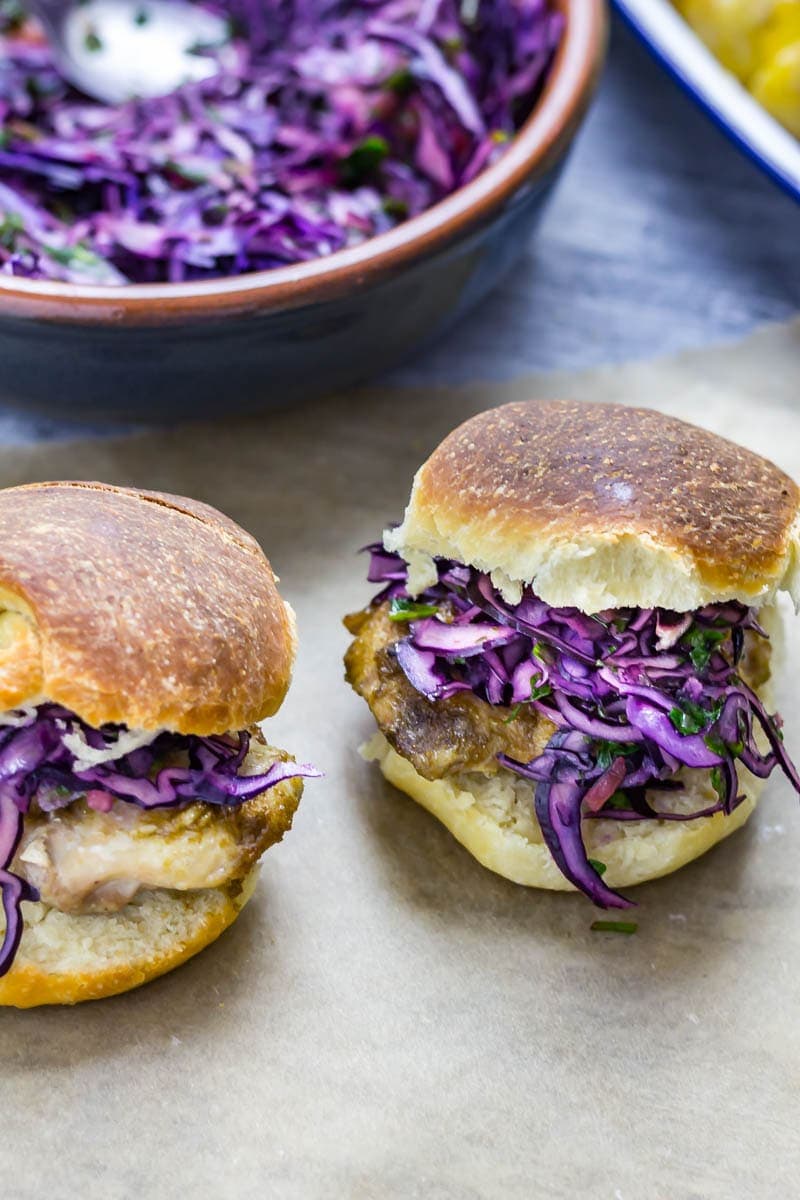 Cumin Rubbed Chicken Sandwich, Chimichurri Slaw & Chipotle Potato Salad. This cumin rubbed chicken sandwich is served with a delicious herby chimichurri slaw and a spicy chipotle potato salad! #chickensandwich #chicken #recipe 