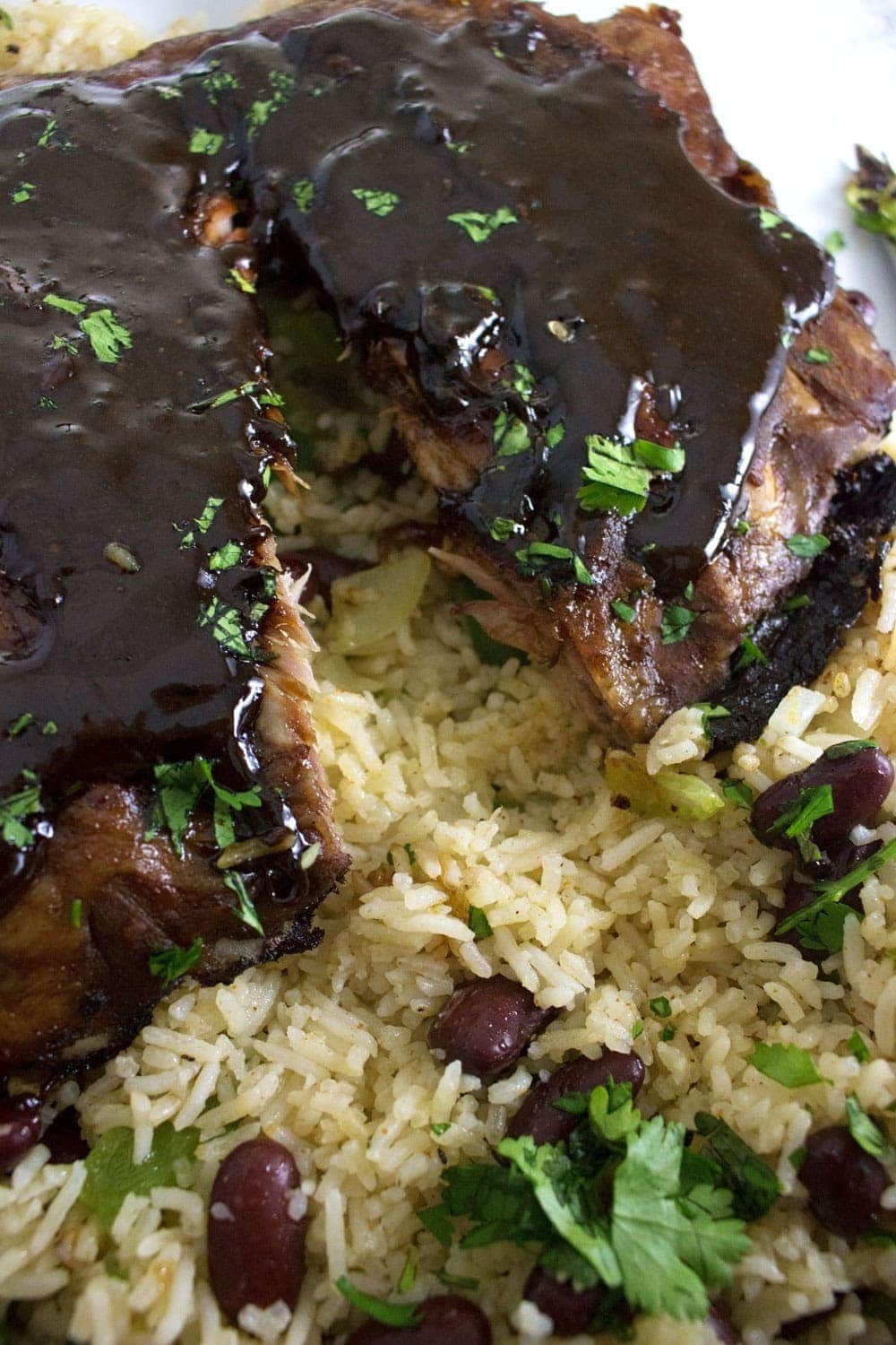 These sticky oven baked Cajun pork ribs are the perfect autumn dinner. Made with a brown sugar and spice dry rub and cooked in a flavourful braising liquid.