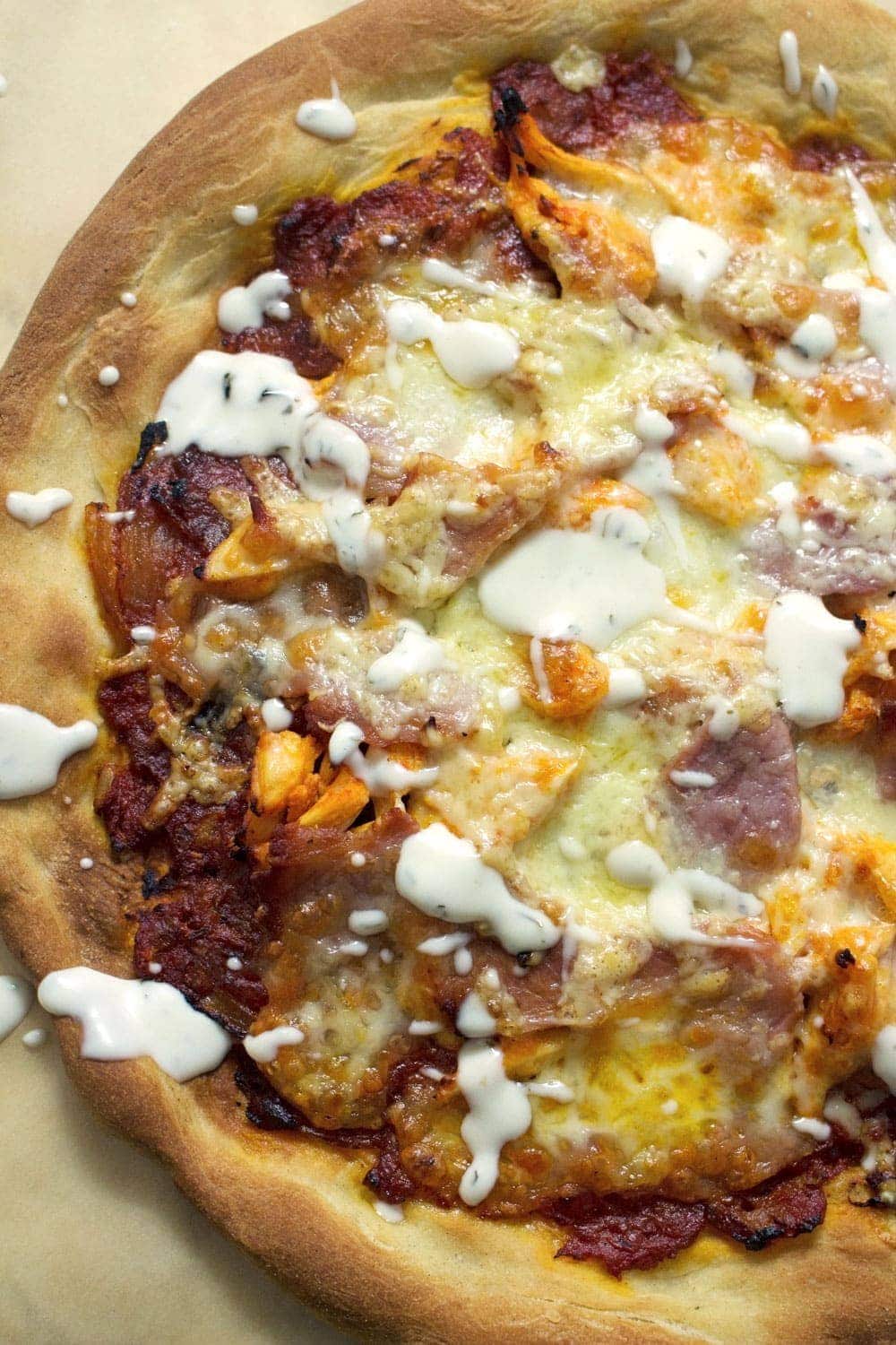 This sriracha chicken bacon ranch pizza is the perfect combination of spicy and salty with a hint of creamy ranch to finish things off!