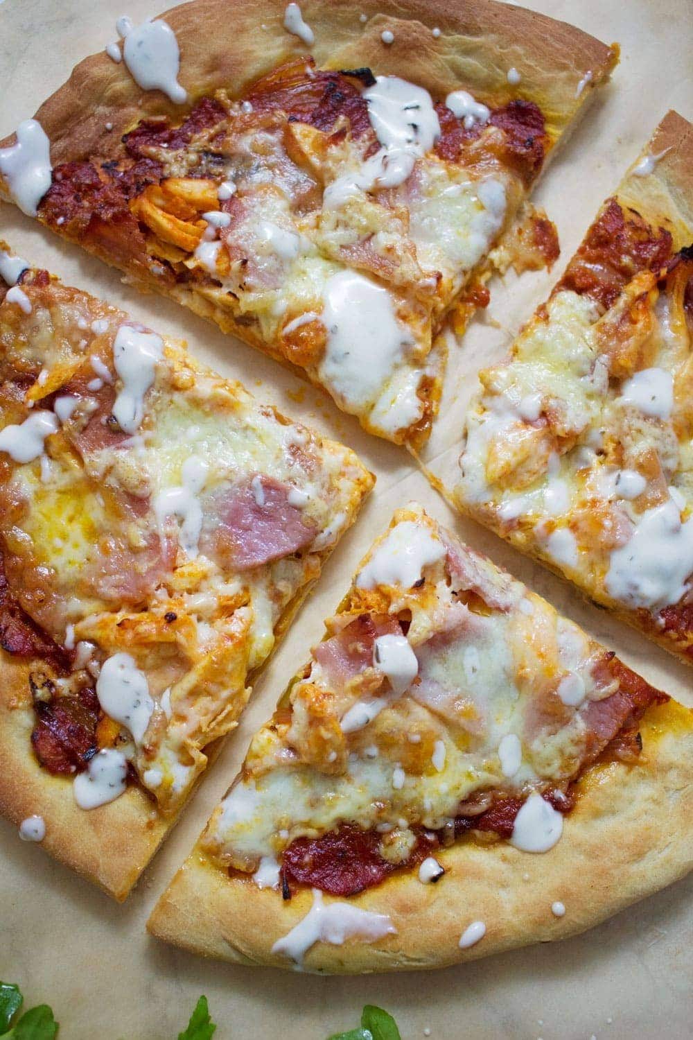 This sriracha chicken bacon ranch pizza is the perfect combination of spicy and salty with a hint of creamy ranch to finish things off!