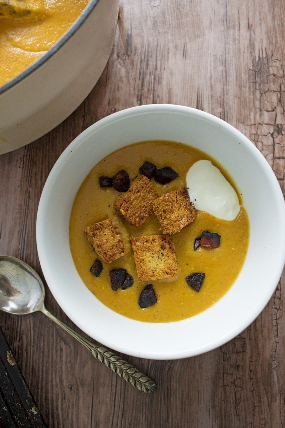 Sweet potato soup spiced with ras-el-hanout and topped with sumac croutons and crispy chorizo. Finish off with a dollop of yoghurt for a filling winter meal.
