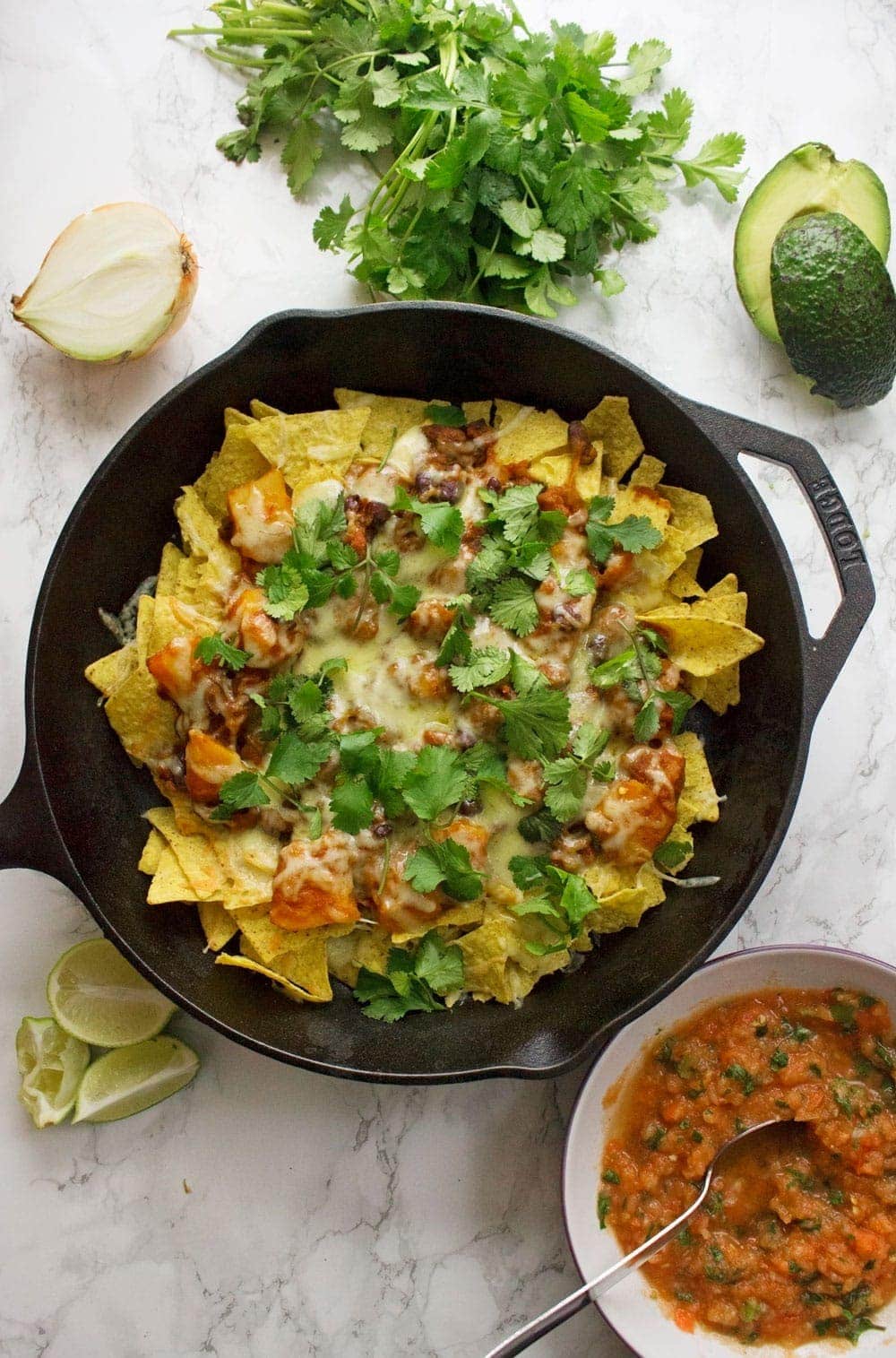 This healthy butternut squash chilli makes the perfect topping for these vegetarian nachos. Add all your favourite toppings for a delicious twist on a classic!