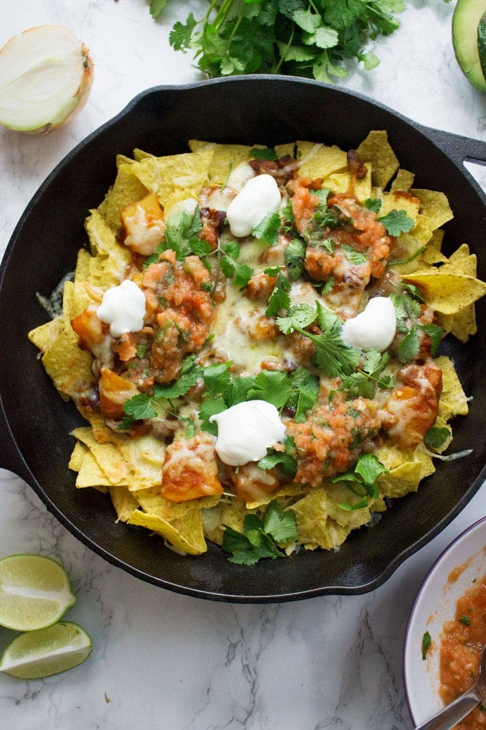 This healthy butternut squash chilli makes the perfect topping for these vegetarian nachos. Add your favourite toppings for a delicious twist on a classic!