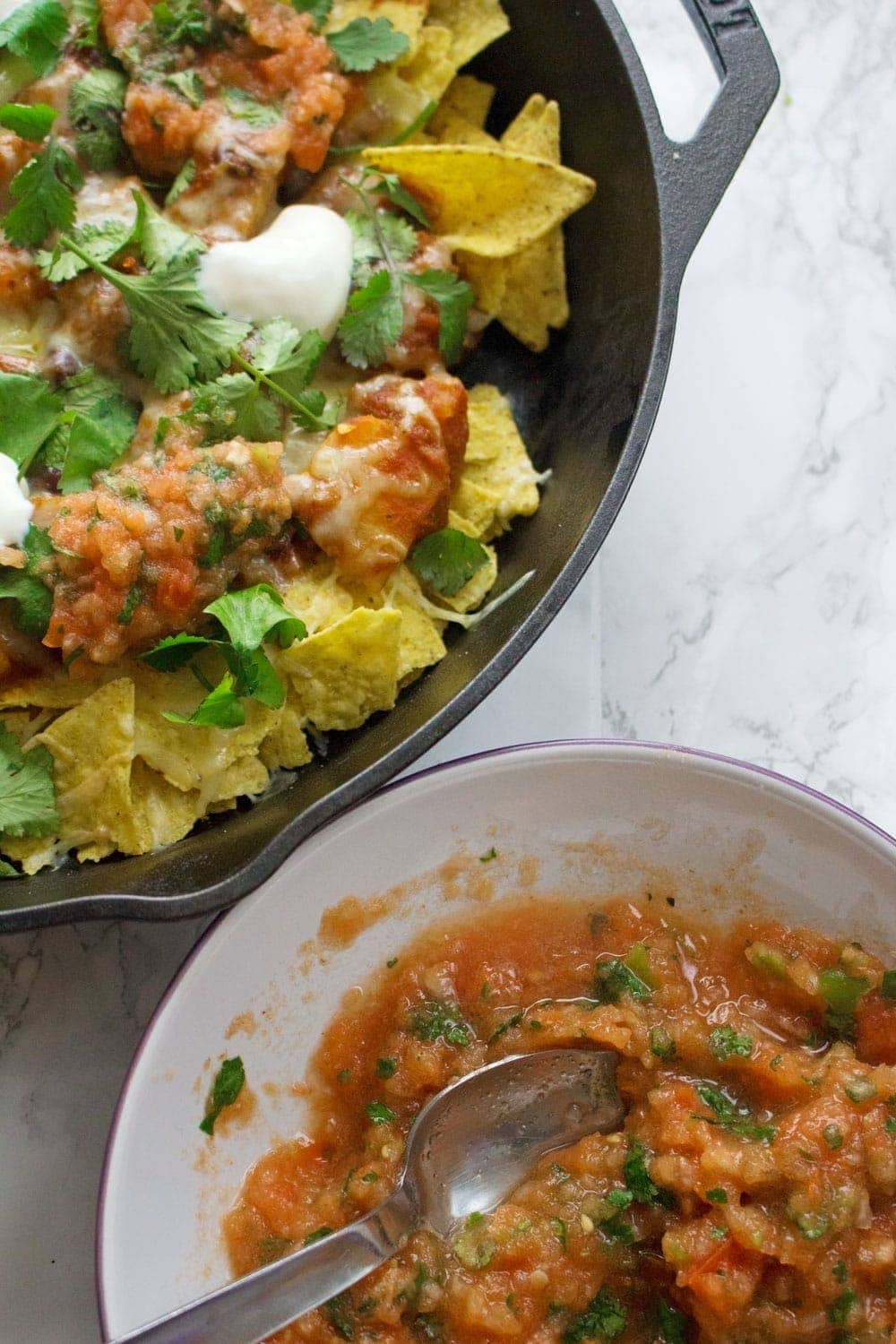 This healthy butternut squash chilli makes the perfect topping for these vegetarian nachos. Add all your favourite toppings for a delicious twist on a classic!