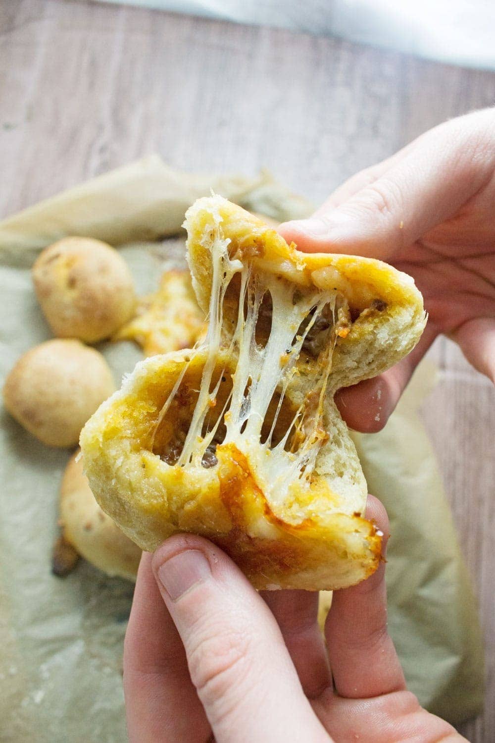 These pesto mozzarella stuffed dough balls make a perfect appetiser. These cheesy dough balls are so easy to make and would be great for a party!