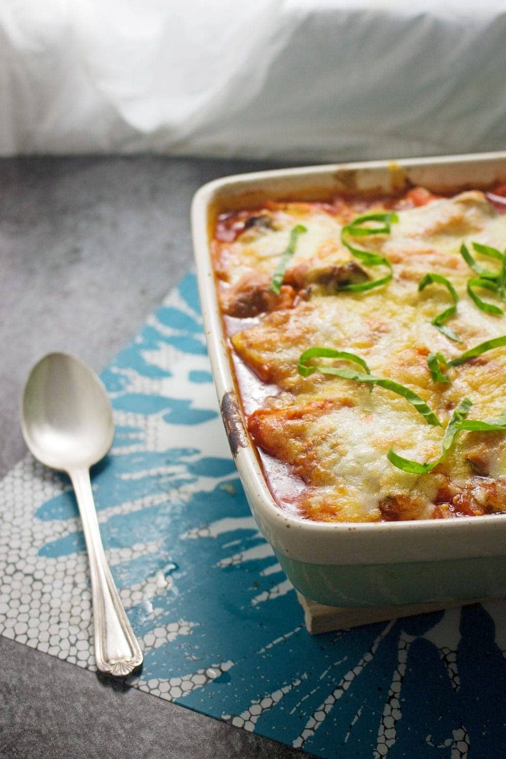 This cheesy veggie pesto polenta bake will keep you warm in winter! Bursting with veg & guaranteed to fill you up, this is the perfect vegetarian dinner.