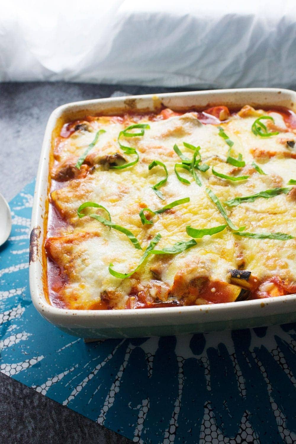 This cheesy veggie pesto polenta bake will keep you warm in winter! Bursting with veg & guaranteed to fill you up, this is the perfect vegetarian dinner.