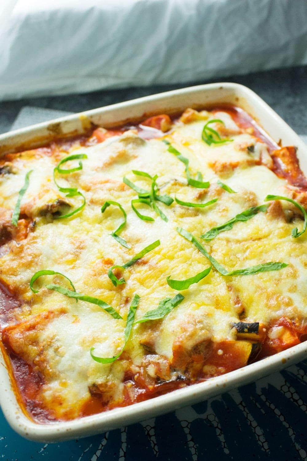 This cheesy veggie pesto polenta bake will keep you warm in winter! Bursting with veg & guaranteed to fill you up, this is the perfect vegetarian dinner.