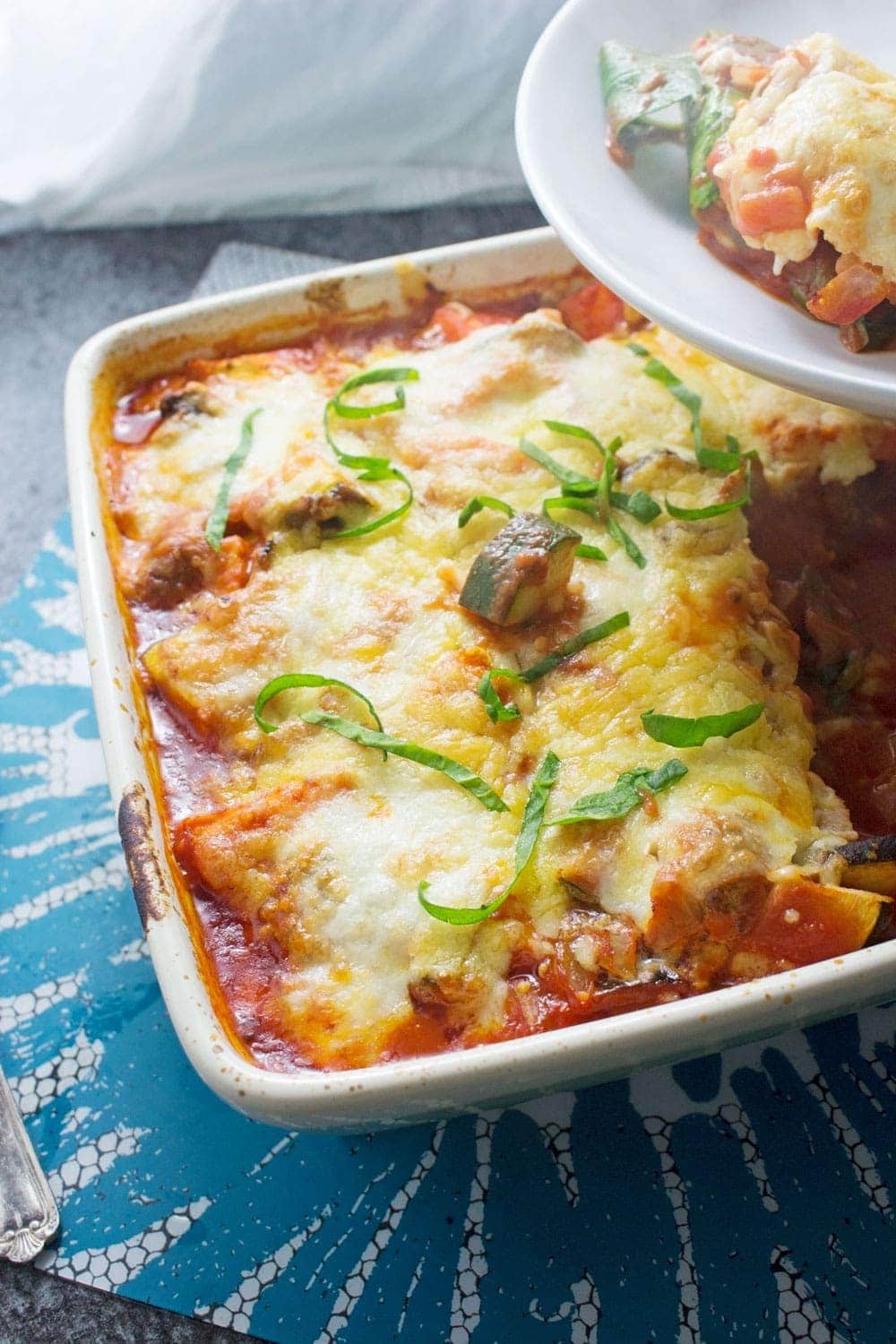 This cheesy veggie pesto polenta bake will keep you warm in winter! Bursting with veg & guaranteed to fill you up, this is the perfect vegetarian dinner.