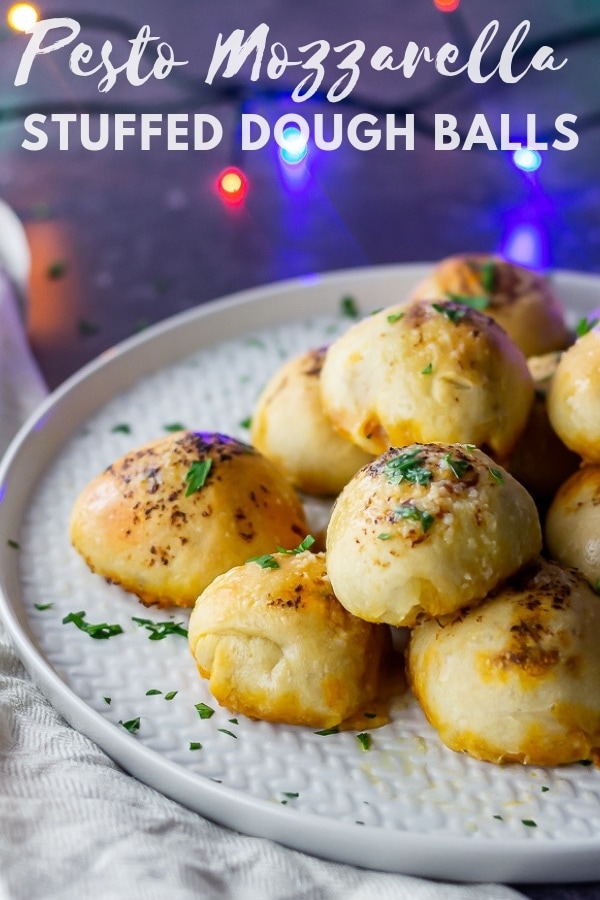 Pinterest image for pesto mozzarella stuffed dough balls with text overlay