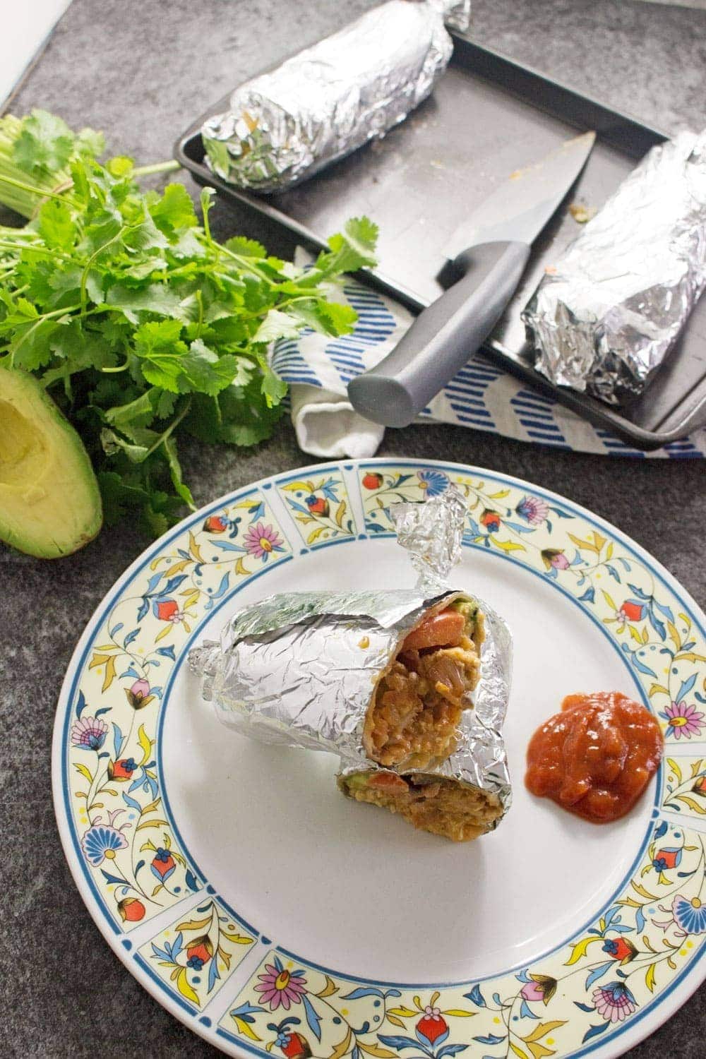 This breakfast burrito stuffed with bacon, egg and hash browns give you the perfect start to the day! They're an impressive but easy to make breakfast.