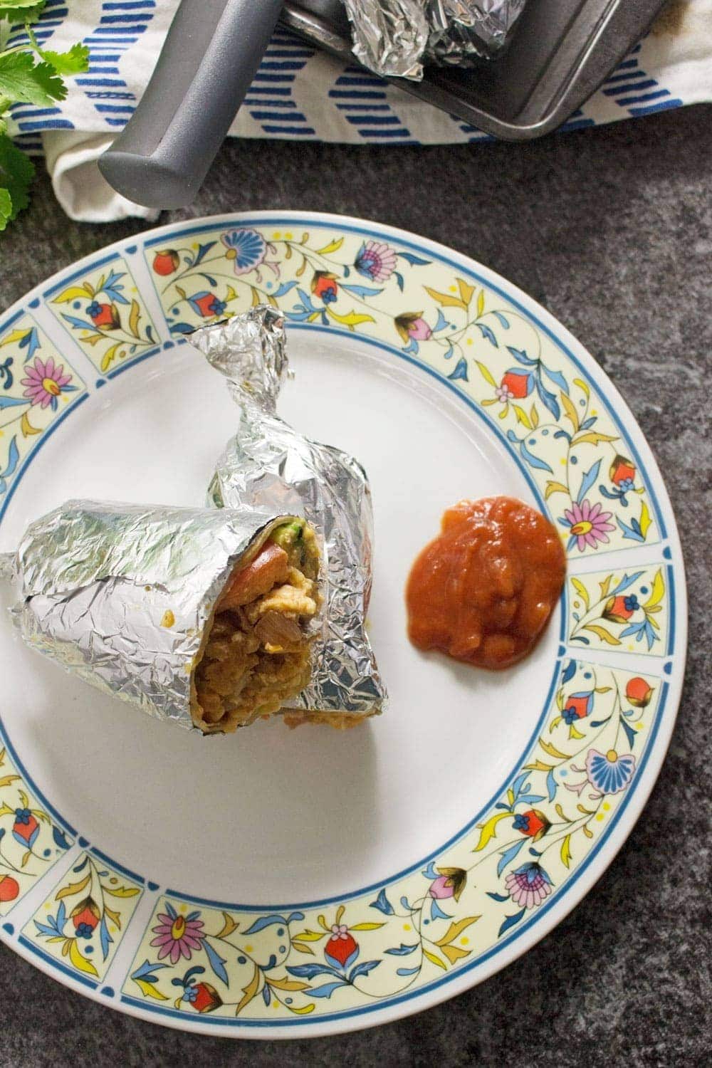 This breakfast burrito stuffed with bacon, egg and hash browns give you the perfect start to the day! They're an impressive but easy to make breakfast.