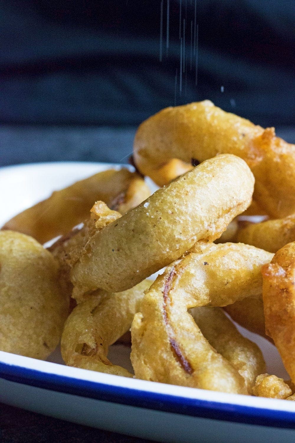 This Caribbean style fish and chips is made up of rum battered fish, sweet potato fries, jerk onion rings and an incredible coconut curry sauce! 