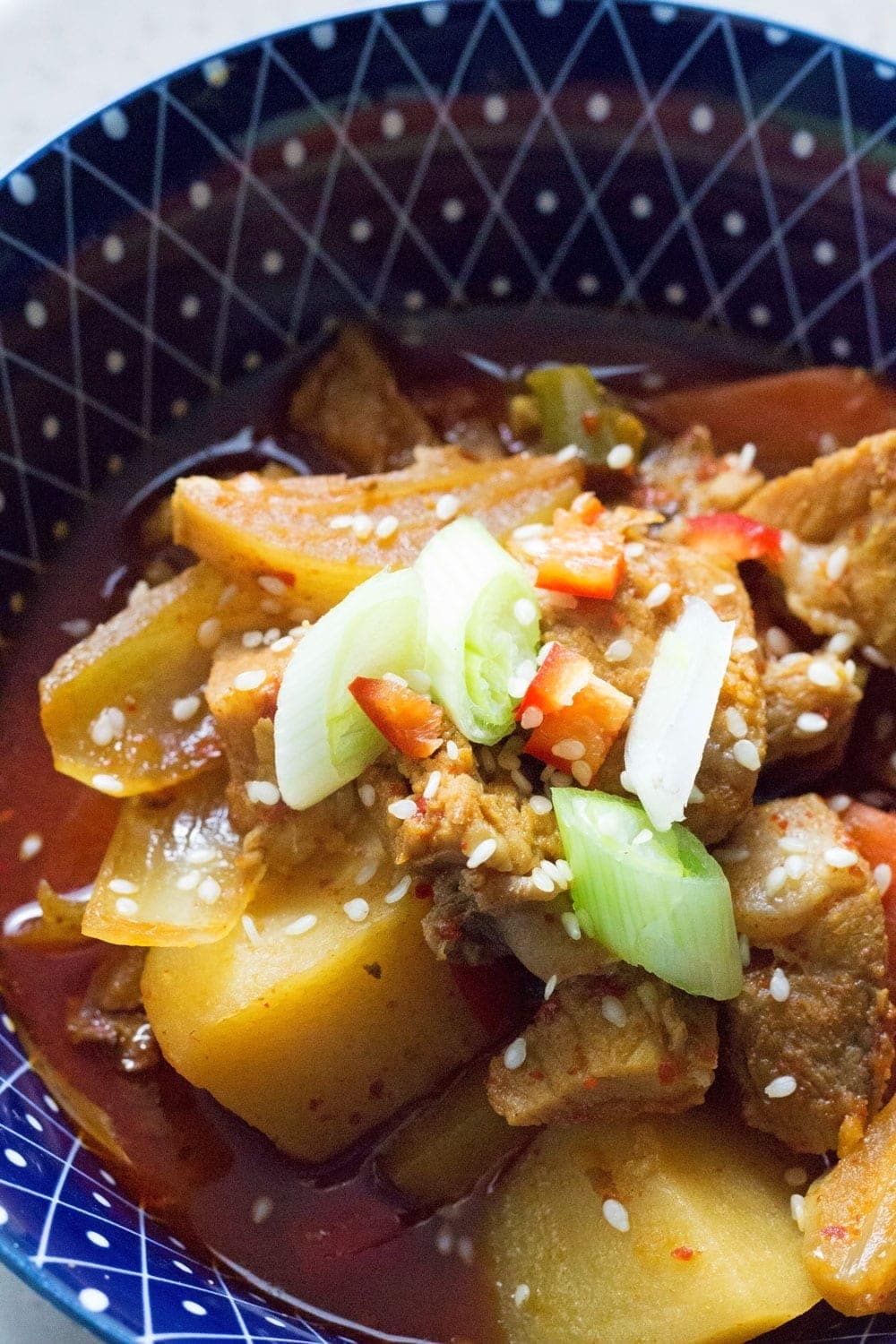 This Korean pork & potato stew is full of warm, spicy flavour. Slow cooking it makes the meat fall apart. It's the perfect winter warmer.