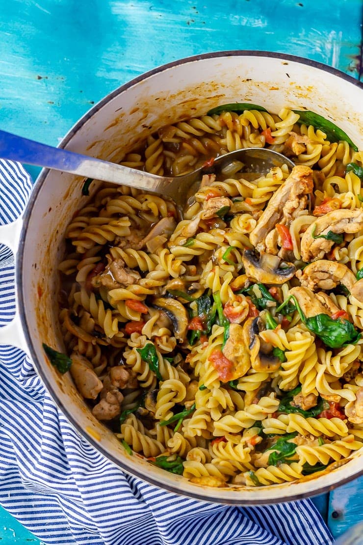 Overhead shot of one pot pasta on a blue background