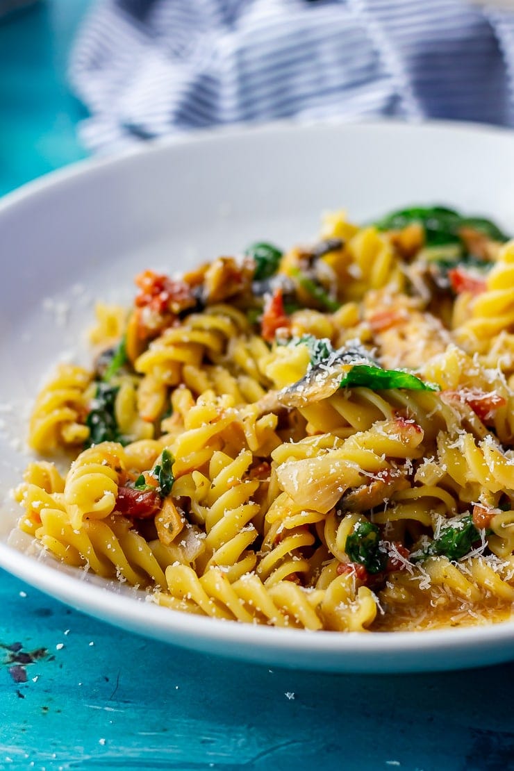 Close up of one pot pasta in a white bowl