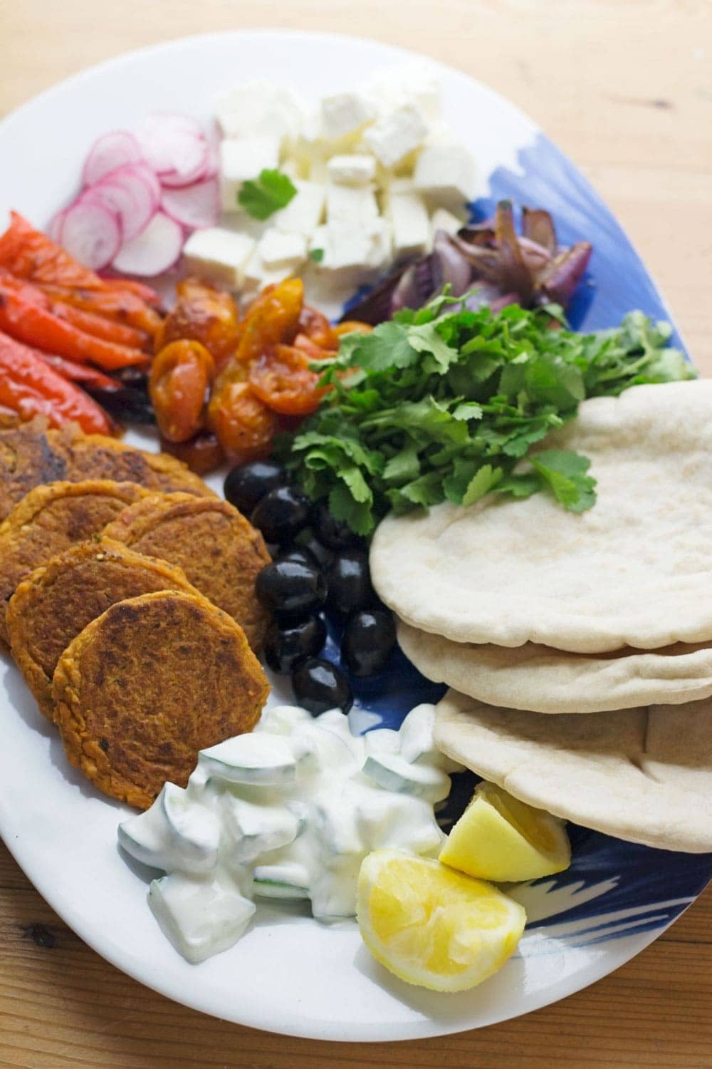 This harissa falafel recipe is spiced with rose harissa & aleppo chilli flakes. Serve with roasted vegetables & cucumber yoghurt for a delicious meal!