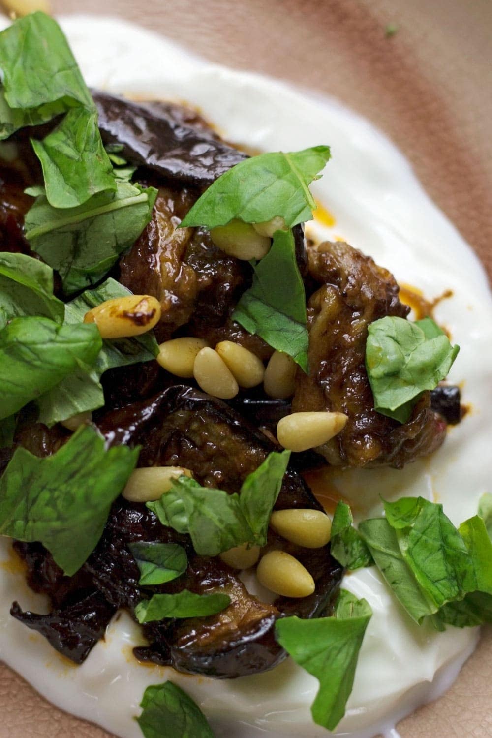 This roast aubergine gets a rich balsamic flavour from the black garlic cooled down by a bed of Greek yoghurt. Serve with Israeli couscous.