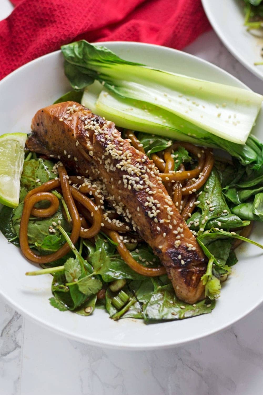 This fresh and healthy teriyaki salmon with udon noodles is a delicious summer dinner with a spicy kick. Serve with spinach and pak choi.