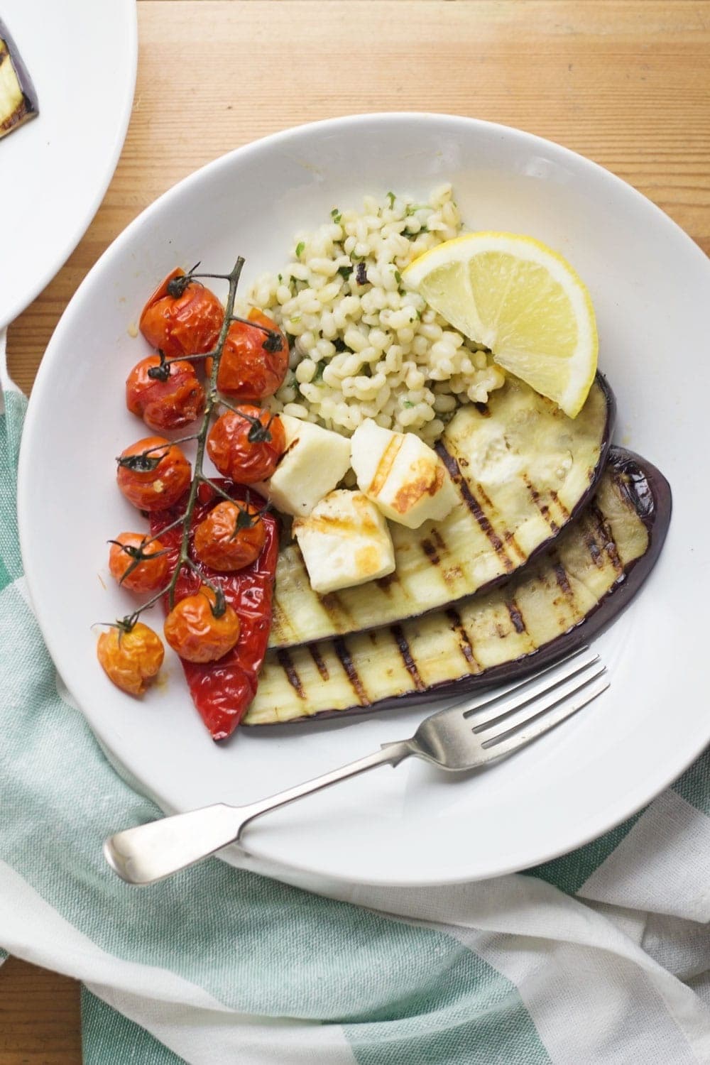 Summer dinner is here with this griddled halloumi served over herby pearl barley. Roasted veg helps to make this a really healthy and delicious meal.