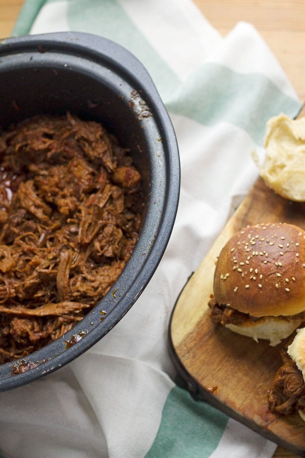 Beef brisket is slow cooked until meltingly tender for this spicy slow cooker pulled brisket. Serve in rolls or wraps for a delicious dinner!